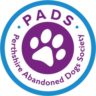 Perthshire Abandoned Dogs Society roundel with a paw print in the middle and purple text