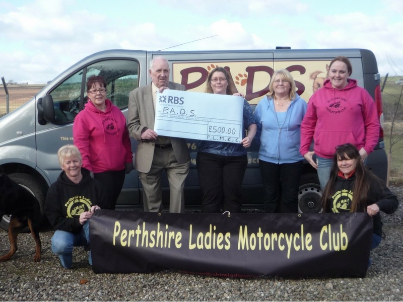 Handing over £500 cheque to Perthshire Abandoned Dogs Society